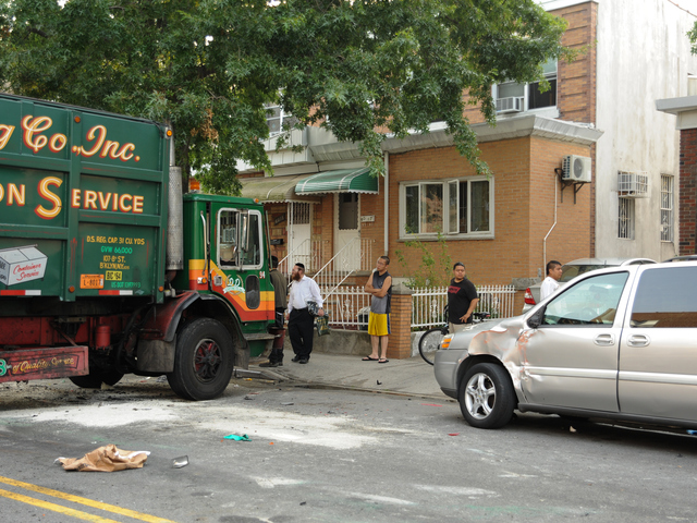 A parked vehicle at the scene also suffered damage in Wednesday's collision Aug. 8, 2012.