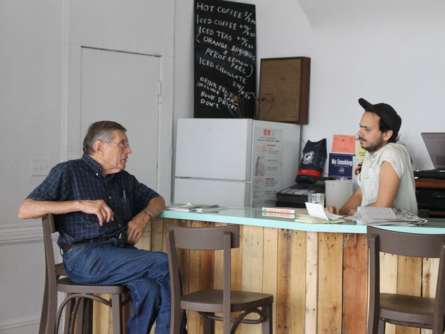 Molasses' owner Matthew Winn chatted with longtime Bushwick business owner Marvin Mann.