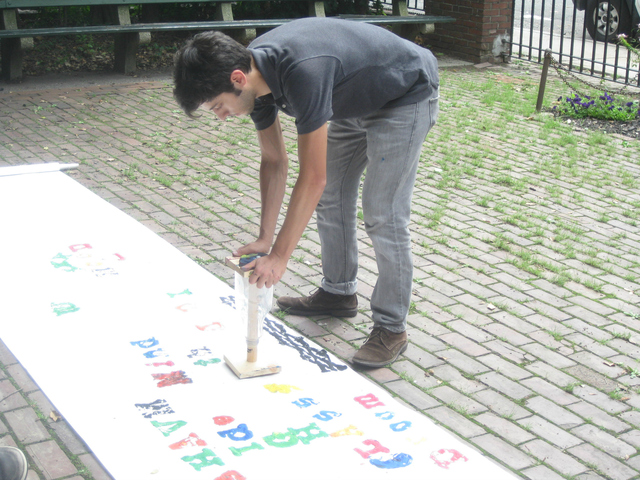 A public art project, SMASH Type, let people become human keys and bash a letter onto a sheet of paper to create a collaborative poem.