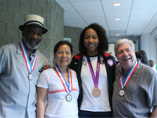 Lia Neal with her parent and Brooklyn Borough President Markowitz. 