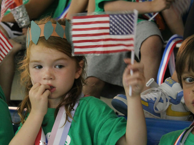 A young swimmer welcomes Neal home from the Olympics. 