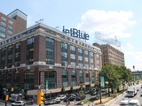 Giant JetBlue Sign Lands on Queens Plaza Rooftop