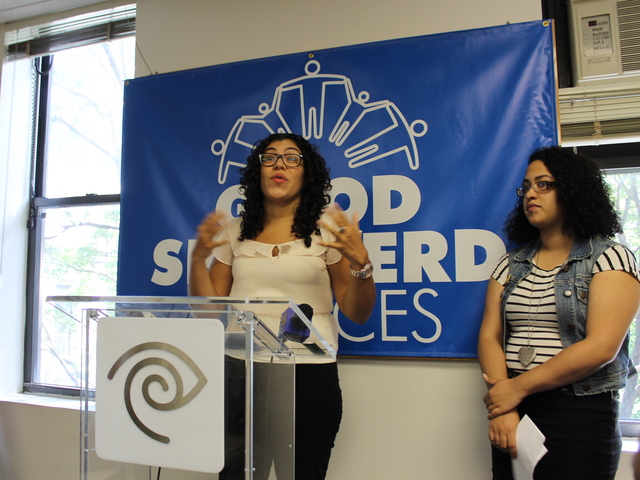 Marisol Zacarias of Good Shepherd Services talks about the nonprofit's new computer lab as 19-year-old Chastity Polanco, a Good Shepherd client, looks on.