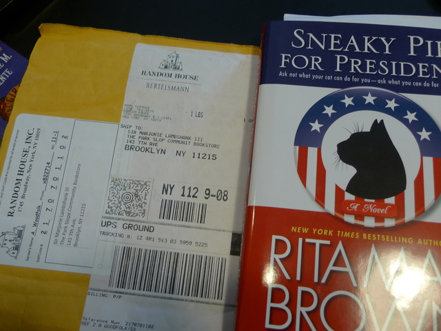 Random House sent a review copy of a new book in the mystery series by Rita Mae Brown and her cat  co-author, Sneaky Pie, to the store's cat, Sir Marjorie Lambshank III.