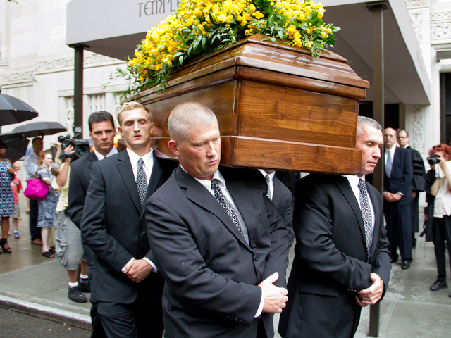 Pall bearers carry the casket of Marvin Hamlisch Aug. 14 out of Temple Emanu-El at 65th Street  and 5th Avenue on the Upper East Side. 