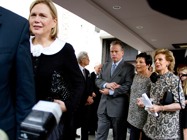 Terre Blair (left), wife of Marvin Hamlisch, who died Aug. 6, proceeds from the funeral of her husband at Temple Emanu-El Aug. 14 to a limousine on 5th Avenue.  Liza Minnelli, (back, center) with Billy Stritch and Lily Safra, also attended the funeral. 
