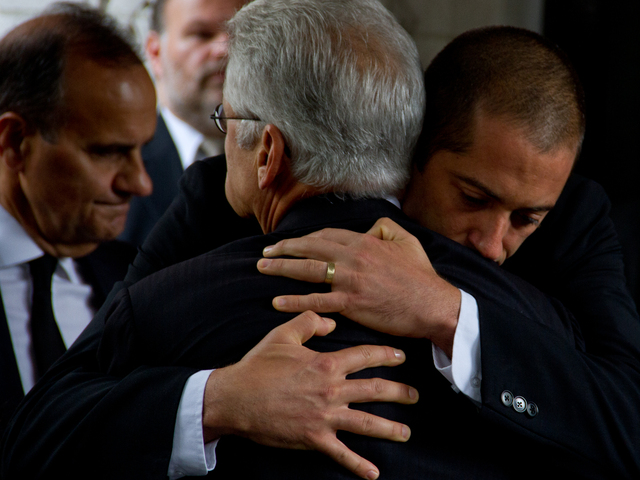 Friends and family embrace outside Temple Emanu-El at 65th Street and Fifth Avenue after the funeral of Marvin Hamlisch Aug. 16. Former Yankees manager Joe Torre (left) attended, too. 