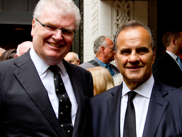Sir Howard Stringer (left) a good friend of Marvin Hamlisch, with Joe Torre, poses for a picture outside of Temple Emanu-El at 65th Street and Fifth Avenue after the funeral of Hamlisch Aug. 16. 