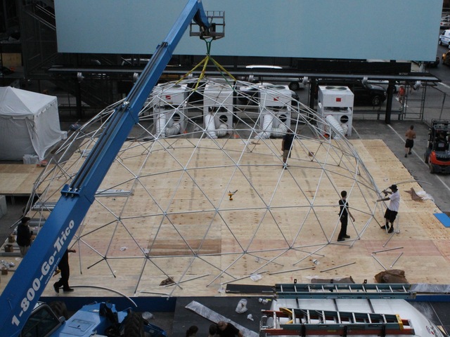 Workers set up a giant snow globe under the High Line as part of Jaguar's ChillNY.