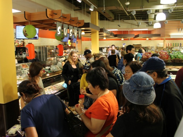 Crowds of shoppers flocked to 55 Fulton Market on its opening day Aug. 15, 2012. 