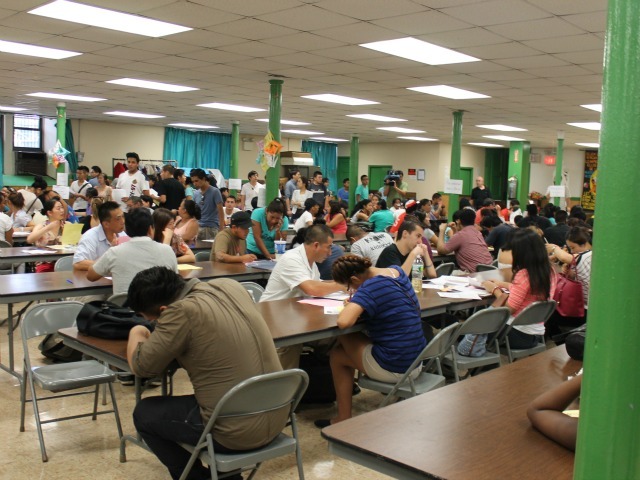 Hundreds of young people packed the church hoping to apply for new work permits.