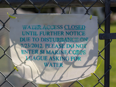 <p>The sign on the fence of the unnamed natural spring on Sunnyside telling water lovers the spring is closed indefinitely.</p>

