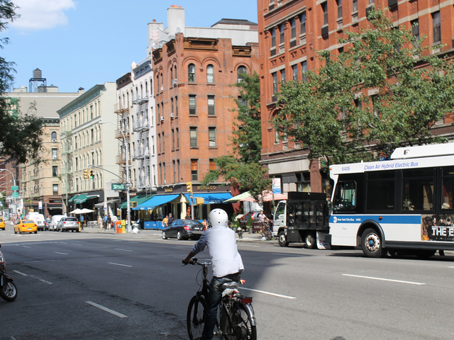 A food-delivery cyclist rides on Amsterdam Avenue on Aug. 16, 2012. The city will ramp up its enforcement of traffic rules for commercial cyclists in January.