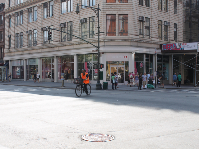 A food-delivery cyclist rides on the Upper West Side on Aug. 16, 2012. The city will ramp up its enforcement of traffic rules for commercial cyclists in January.