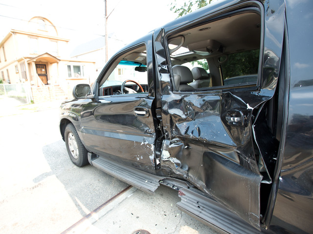 The Cadillac Escalade that allegedly struck two people on a motorcycle in Queens Aug. 17, 2012. 