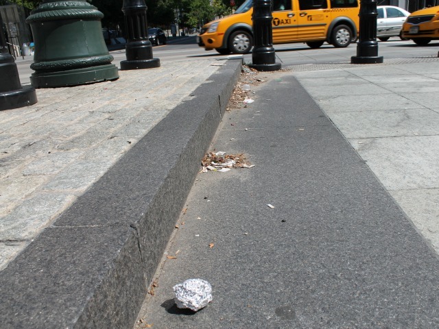 Garbage and cigarette butts are building up at West Street crossings in Lower Manhattan. 