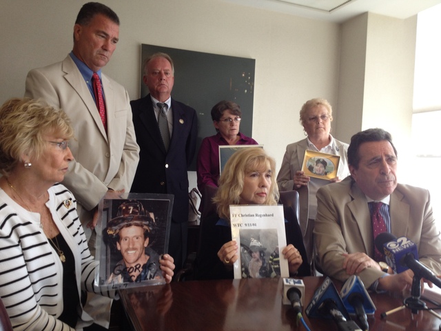 From left to right: 9/11 victims' parents Rosemary Cain, retired FDNY deputy chief Jim Riches, Russell Mercer, Sally Regenhard, Joyce Mercer, Eileen Walsh and attorney Norman Siegel gather at Siegel's Midtown law office to discuss an appeal they have filed to obtain the names and addresses of all the 9/11 victims' families.