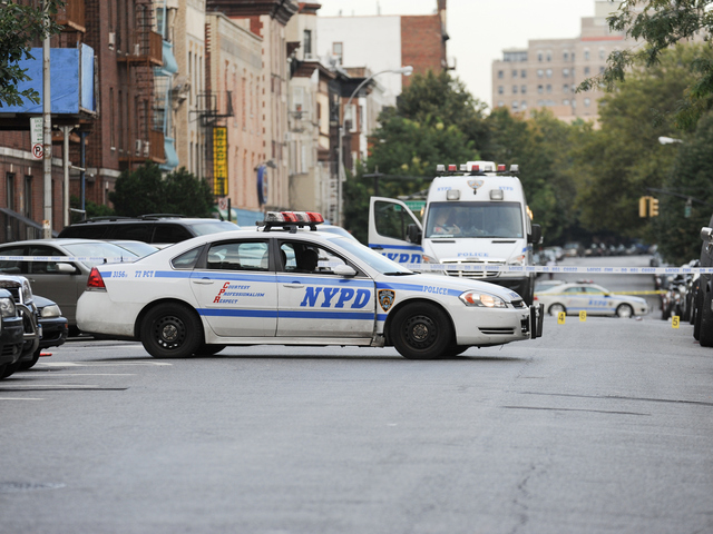 <p>Police at the scene on Saint Marks Avenue where a 17-year-old Darius Robinson was fatally shot on Tuesday August 21st, 2012.</p>
