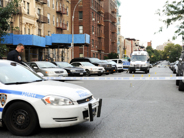 <p>Police at the scene on Saint Marks Avenue where 17 year-old Darius Robinson was fatally shot on Tuesday August 21st, 2012.</p>
