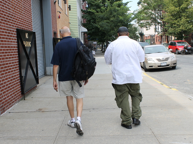 Bob, left, and another resident strolled away from the shelter at 400 McGuiness Blvd., where they said they have been staying the past two weeks.