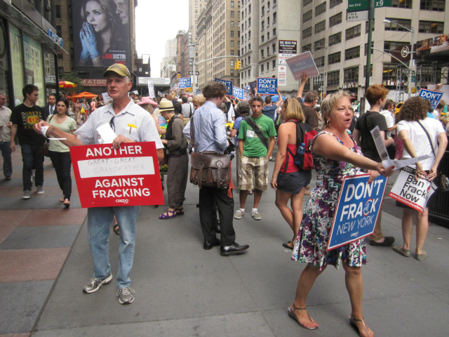 Dozens of protesters gathered at corner of West 53rd Street and Seventh Avenue on Wednesday, Aug. 22, 2012, to protest fracking.