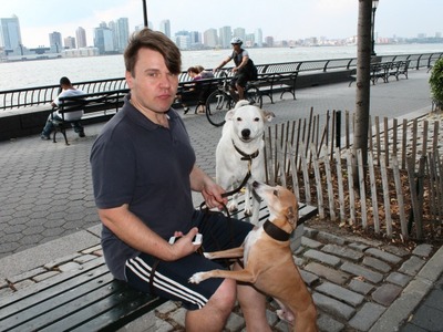 <p>Mikhail Serdiouk, a Gateway Plaza resident, with his two dogs.</p>
