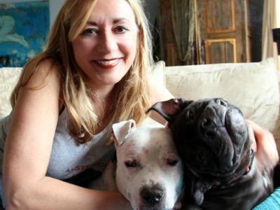 <p>Deborah DiIorio, a Gateway Plaza resident, with her two dogs, both over 40 pounds.</p>

