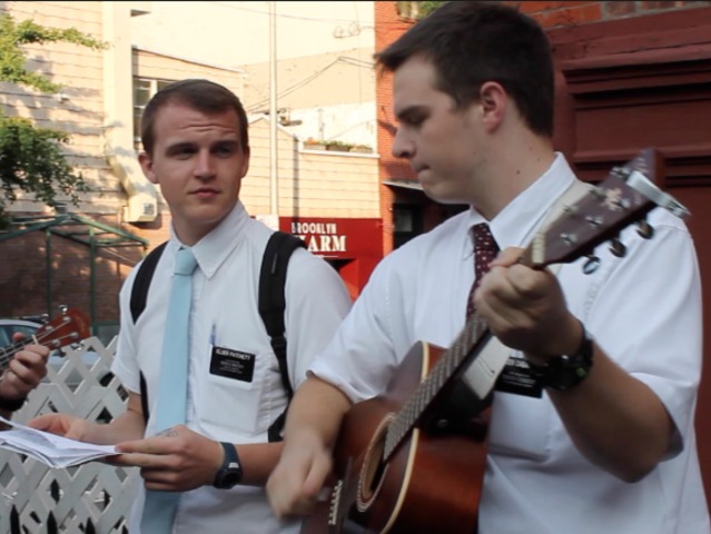 Marc Cabanilla played guitar to lead his group of dozen missionaries in song on Bedford Avenue and North Ninth Street one recent evening. The young men have started performing regularly on Bedford Avenue.