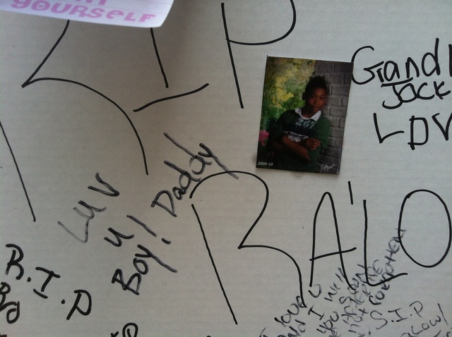 A photo stuck to a shrine set up for Ronald Wallace, 13, who was shot on August 24, 2012. 