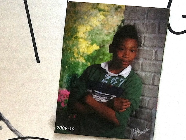 A photo of Ronald Wallace, 13, taken in 2009, that hung on a shrine set up after he was fatally shot August 24, 2012.
