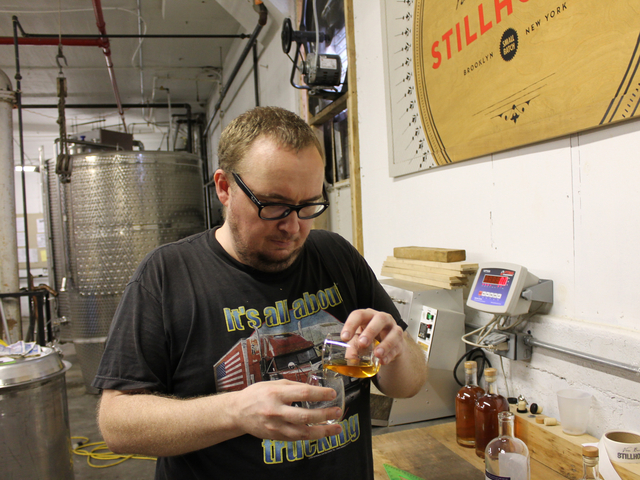 Before sipping Van Brunt Stillhouse's Due North rum, assistant distiller David Lewis, 35, suggests letting it 