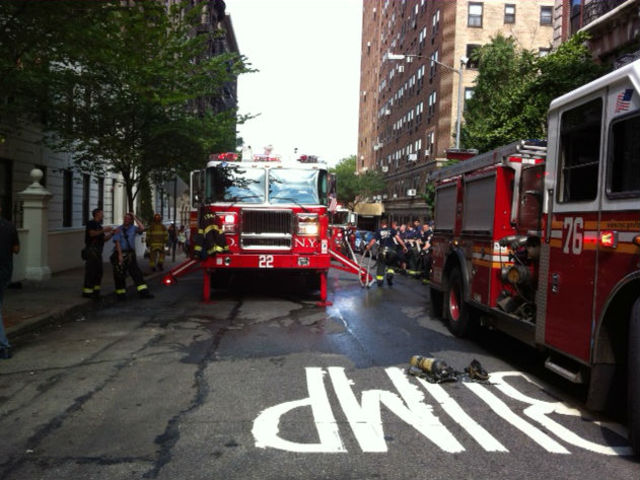 Fire trucks arrive at West 95th Street after a small bedroom fire broke out.
