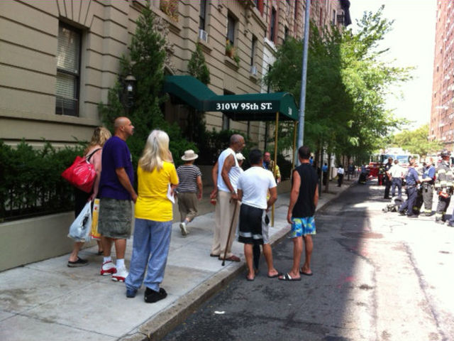 Resident assembled outside 316 West 95th Street after a fire broke out in their building Tuesday morning.
