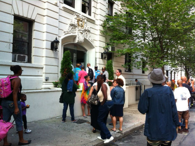 Residents assembled outside their building after being evacuated after a fire began inside. 