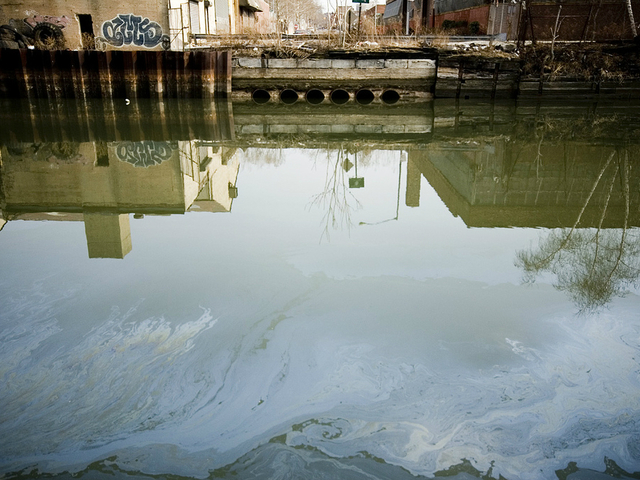<p>Pollution is visible on the surface of the Gowanus Canal, and can also be found below in the sediment.</p>
