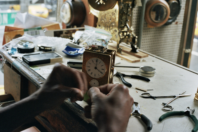 Sebastian Laws works on a clock in his Upper East Side store.