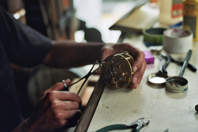 Sebastian Laws, one of the few horologists left in New York City, works out of a tiny space without air conditioning and often without electric light.