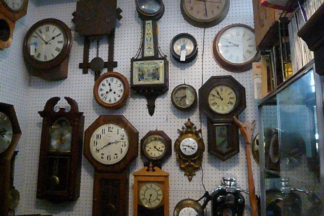 Sutton Clocks, one of the few shops left in NYC with a professional horologist, has a wall filled with clocks.