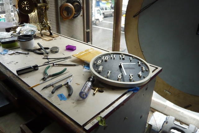 A clock face and other repair parts are among the items at Sutton Clocks.