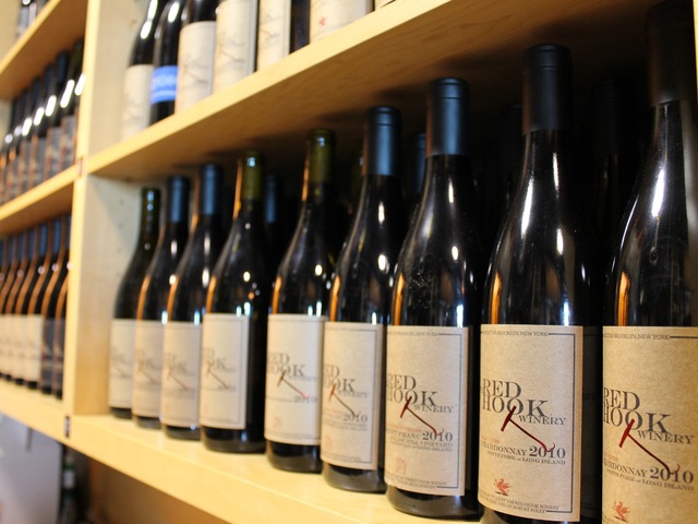 Red Hook Winery bottles line shelves in the tasting area.