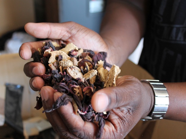 Jackie Summers, co-founder and co-owner of Jack from Brooklyn in Red Hook, holds the herbs and spices that makes Sorel. The mixture — and the drink, which Summers likened to an 
