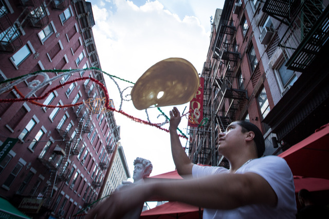 Throwing the pizza, Oscar Hernandez performs an age-old tradition September 1, 2012.