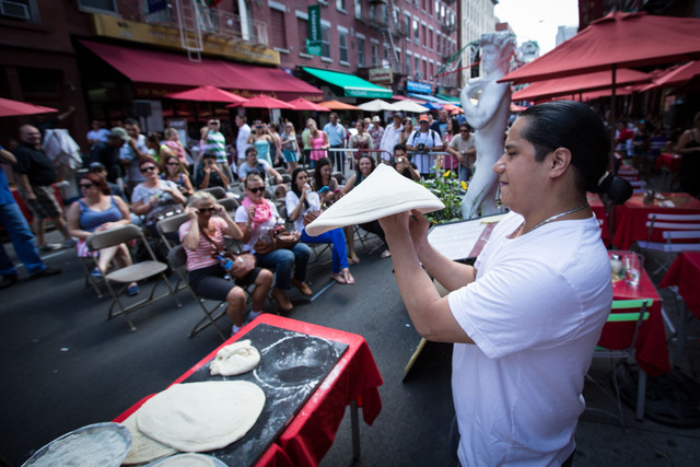 Tourists to the Little Italy had a nice treat of pizza and a show on Saturday afternoon. 