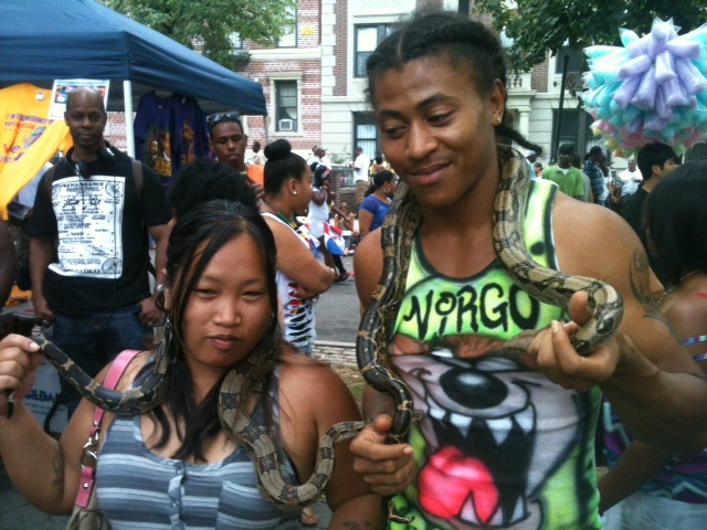 Spectators with snakes at the 2012 West Indian-American Day Parade. Sept. 3, 2012. 