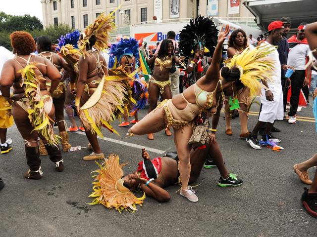 Revelers get down to the ground on Eastern Parkway on Monday Sept. 3, 2012.