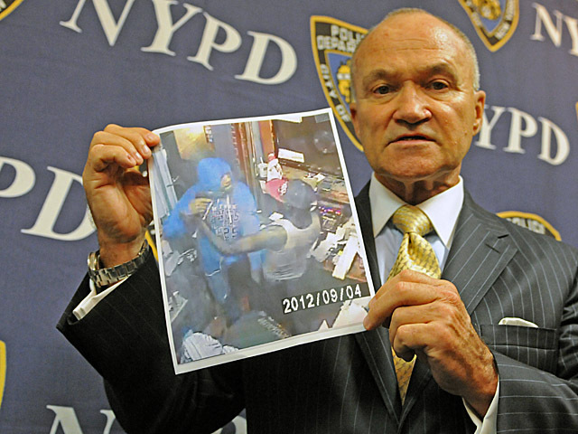 Police Commissioner Ray Kelly holding a picture of the man suspected of gunning down a 28-year-old Bronx gas station attendant in a robbery Sept. 4.