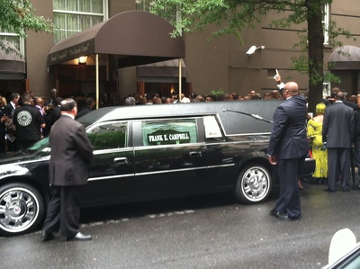 The crowd outside made it difficult for the funeral procession to leave.