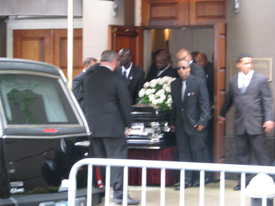 Chris Lighty's casket is brought out of the funeral home.
