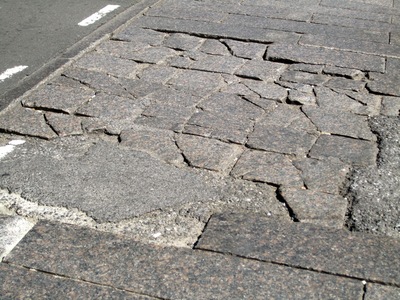 SoHo residents said in September 2012 that they have navigated crumbling cobblestone crosswalks like this one for more than 15 years. The DOT said Sept. 5, 2012 that it plans to repair crosswalks on Mercer Street and Greene Street starting in fall 2012.