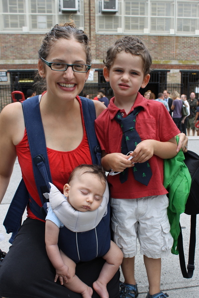Avi Geballe, 3, doesn't start school until next year but he wanted to wear a J. Crew tie with a skull and crossbones motif like his older brother, a first grader at Park Slope's P.S. 321. At left is mom Racher and new brother Micah.